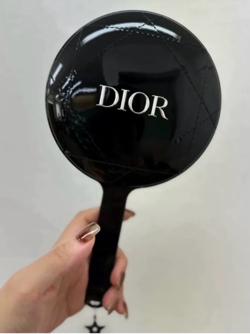 Dior beauty gift holding mirror